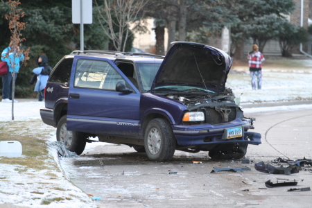 Grand_Forks_auto_accident_no_3261_450x300 Blue GMC Jimmy SUV with hood open and severe damage to front driver side
